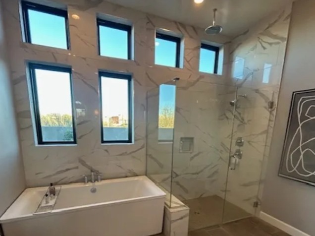 Bathroom remodeling project with glass shower and soaking tub